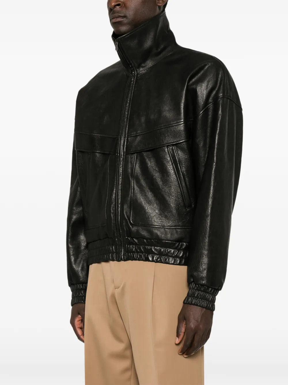 Black jacket worn by a person, showing the jacket fit