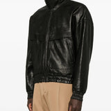 Black jacket worn by a person, showing the jacket fit