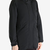 Black coat worn by a person, showing the coat fit