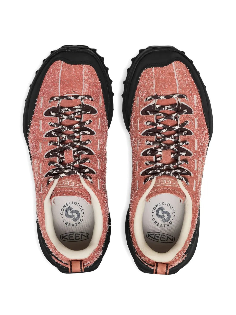 Close up of orange sneakers, showing texture of the leather and rubber fabric