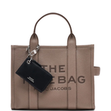 Close up of black bags, showing texture of the leather fabric