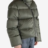 Green jacket worn by a person, showing the jacket's fit