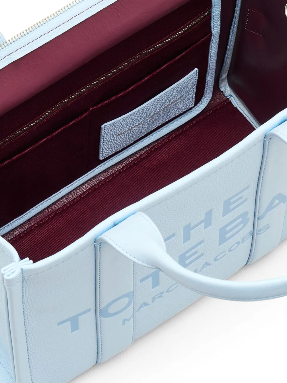 close up of blue bags, showing texture of the leather fabric