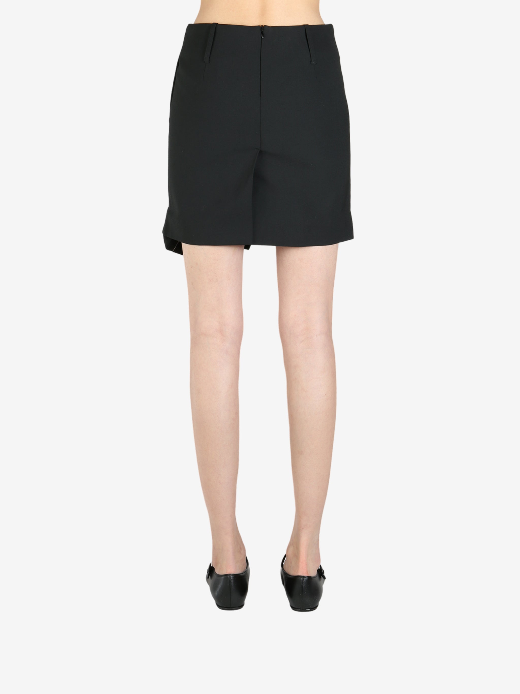 Black skirt worn by a person, showing the skirt's fit