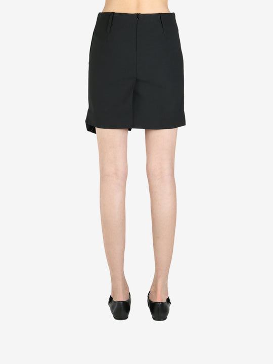 Black skirt worn by a person, showing the skirt's fit