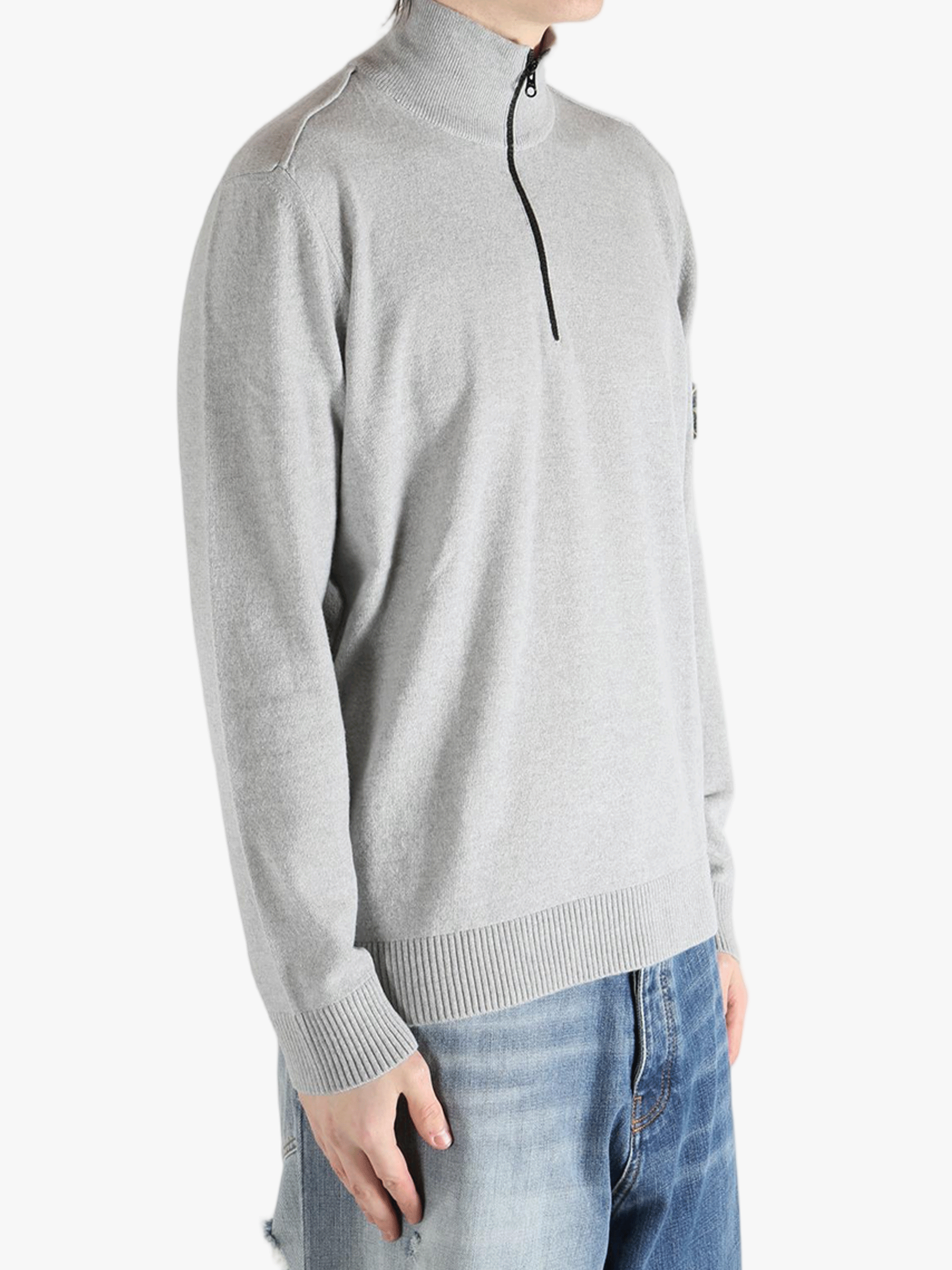 Gray sweater worn by a person, showing the sweater fit