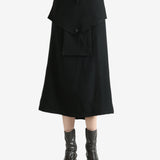 Black skirts worn by a person, showing the skirts fit