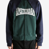 Green sweatshirt worn by a person, showing the sweatshirt's fit