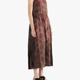 Red dress worn by a person, showing the loose fit.