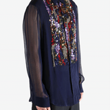 Navy blue shirt worn by a person, showing the shirt's fit