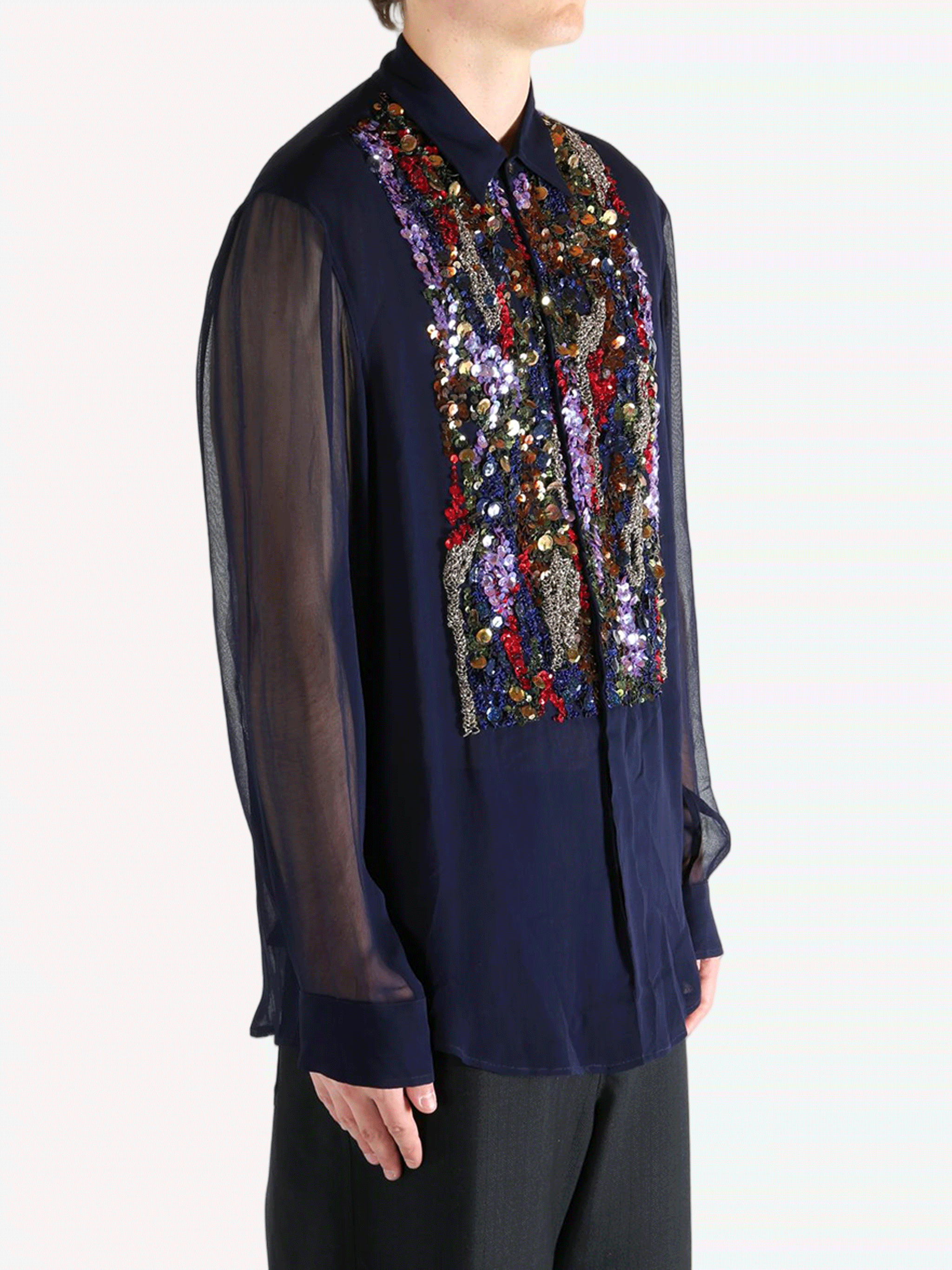 Navy blue shirt worn by a person, showing the shirt's fit