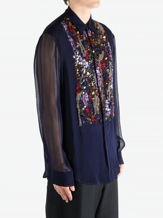 Navy blue shirt worn by a person, showing the shirt's fit