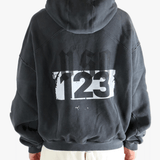 Black hoodie worn by a person, showing the hoodie fit
