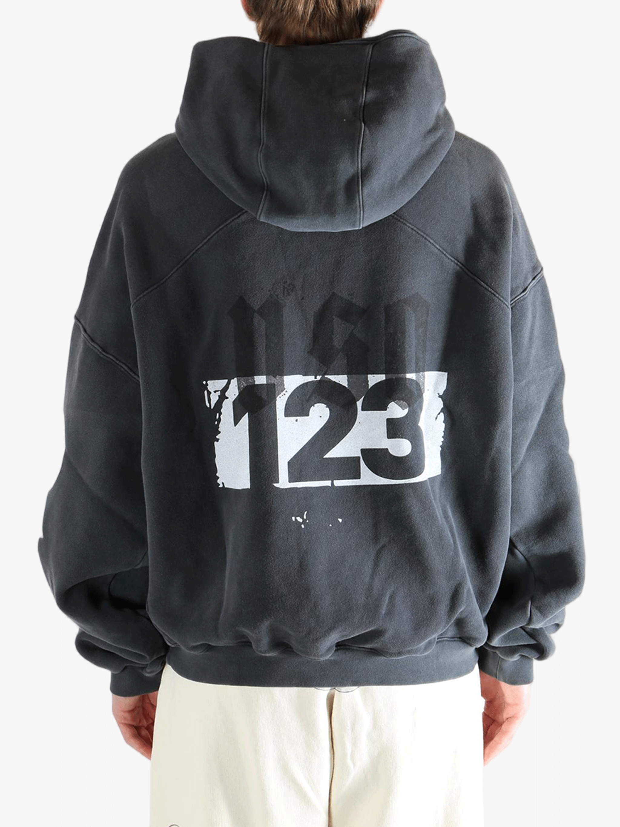 Black hoodie worn by a person, showing the hoodie fit