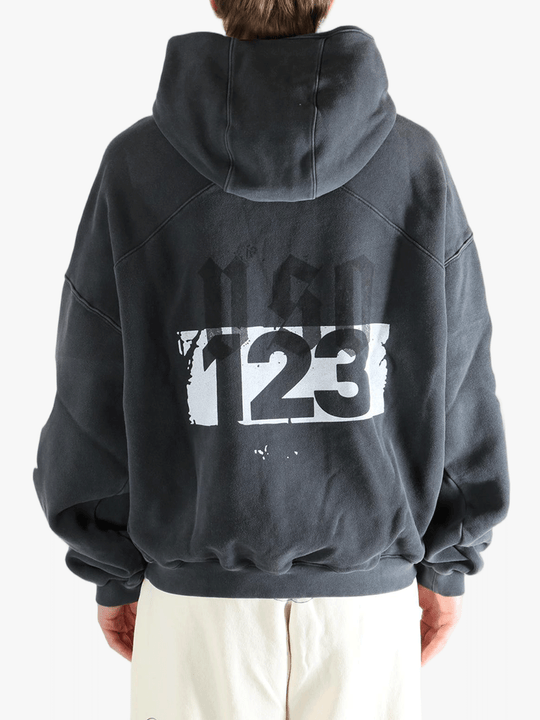 Black hoodie worn by a person, showing the hoodie fit