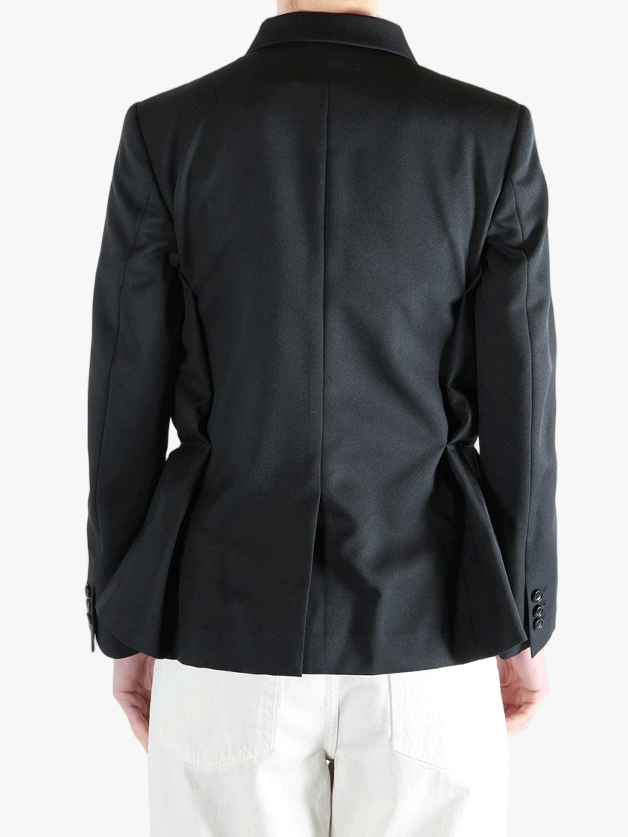 Black jacket worn by a person, showing the jacket's fit
