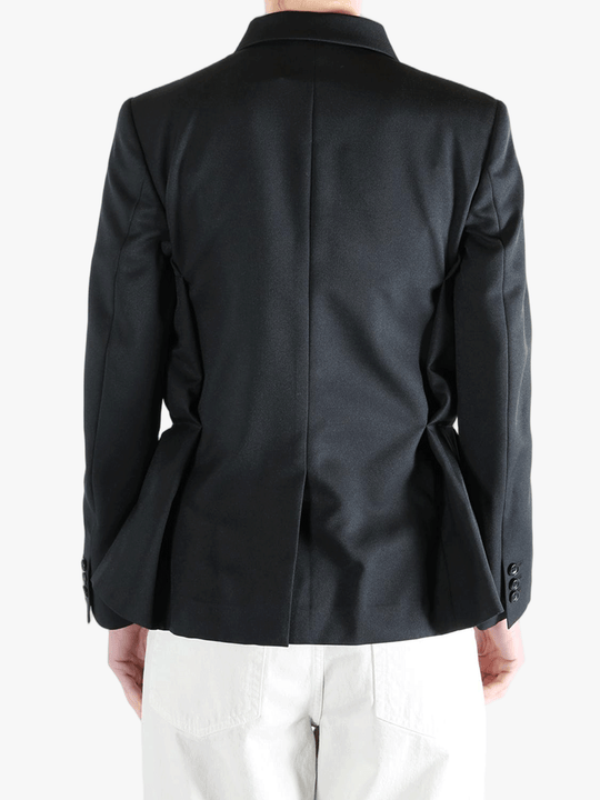 Black jacket worn by a person, showing the jacket's fit