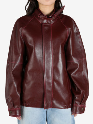 Burgundy jacket worn by a person, showing the jacket's fit