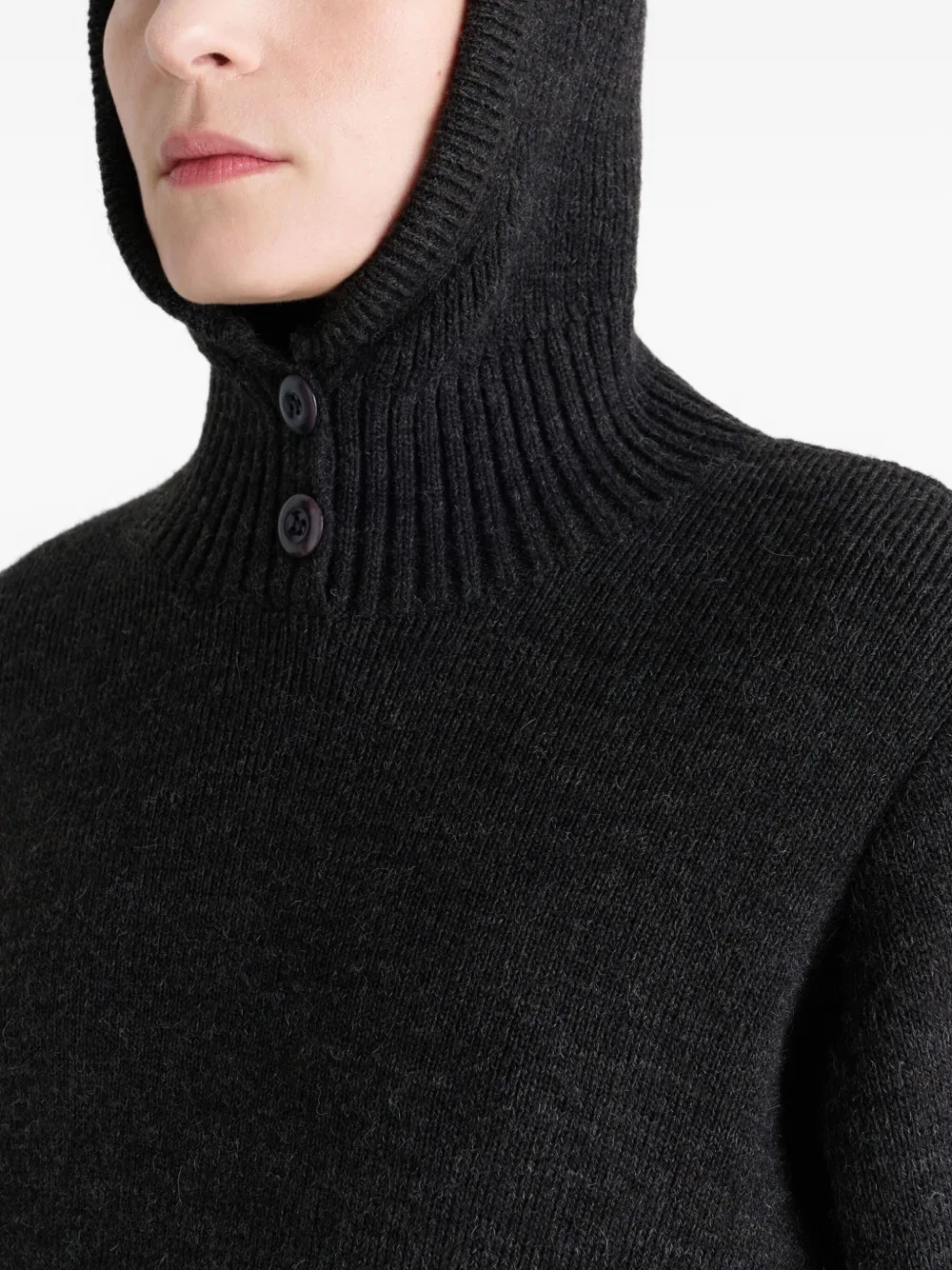 Close up of black sweater,showing texture of the acrylic fabric.