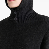 Close up of black sweater,showing texture of the acrylic fabric.