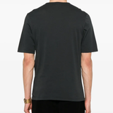 Grey shirt worn by a person, showing the shirt fit