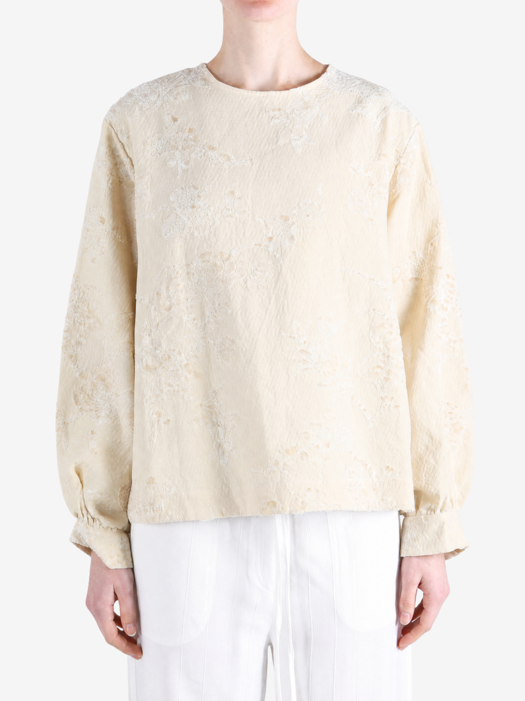 Tan top worn by a person, showing the top fit