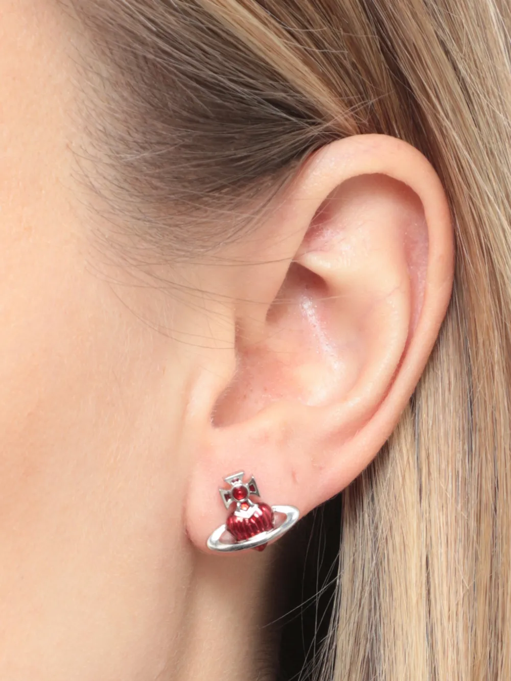 Close up of Red earrings, showing texture of the brass fabric