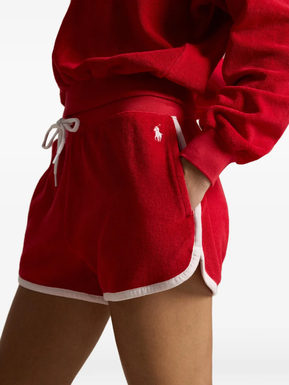 Close up of red short, showing texture of the cotton fabric