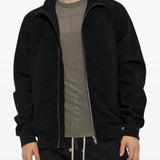 Black hoodie worn by a person, showing the hoodie fit