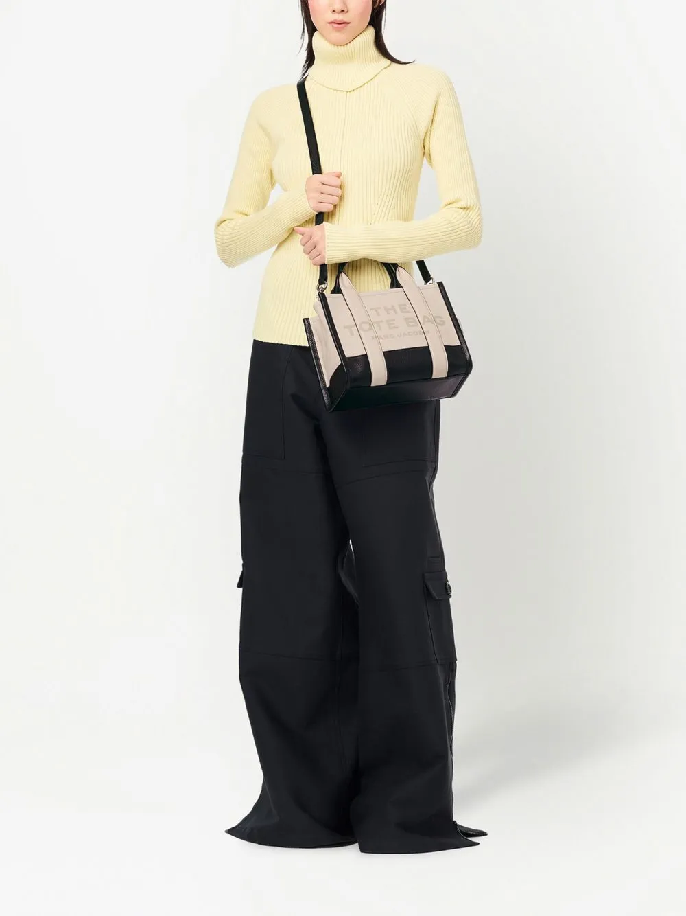 White bag worn by a person, showing the bag's fit