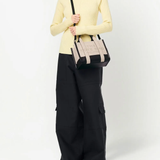 White bag worn by a person, showing the bag's fit