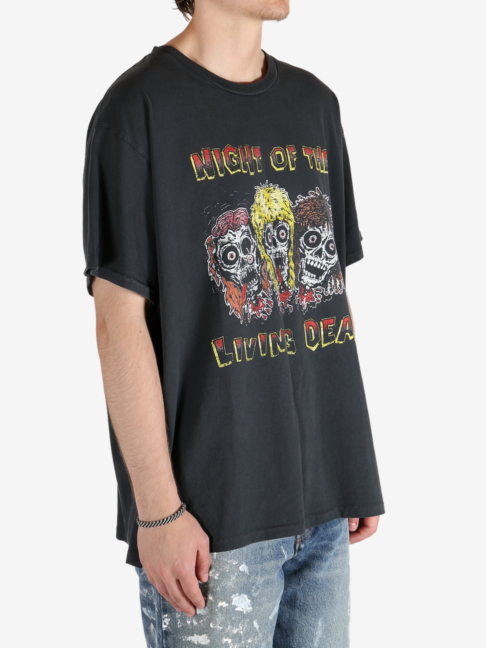 Black t-shirt worn by a person, showing the t-shirt's fit