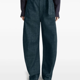 Navy pants worn by a person, showing the pants fit