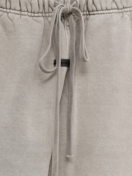 Close up of the grey pants, showing texture of the cotton fabric