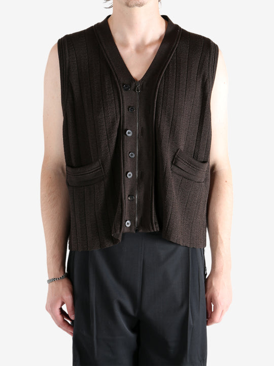 Brown vest worn by a person, showing the vest's fit