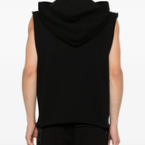 Black sleeveless hoodie worn by a person, showing the shirt's fit