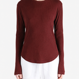 Burgundy top worn by a person, showing the top fit
