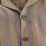 Close up of beige striped shirt,showing texture of the cupro fabric