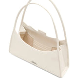 Close up of the white bag, showing texture of the leather fabric