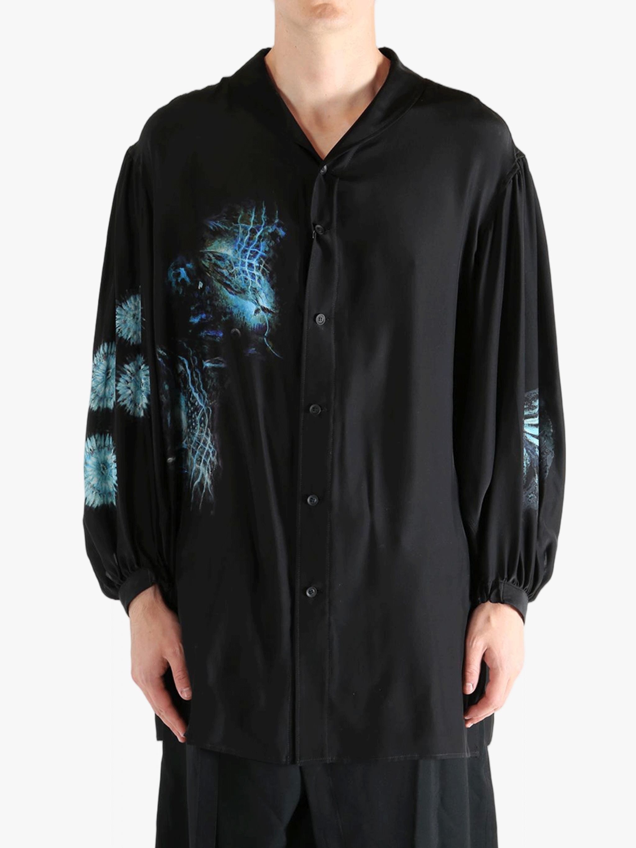 Black shirt worn by a person, showing the shirt's fit