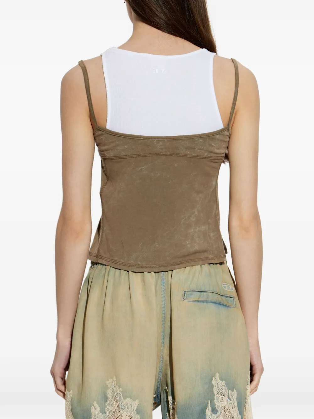 Brown top worn by a person, showing the top's fit