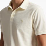 Tan shirt worn by a person, showing the shirt fit