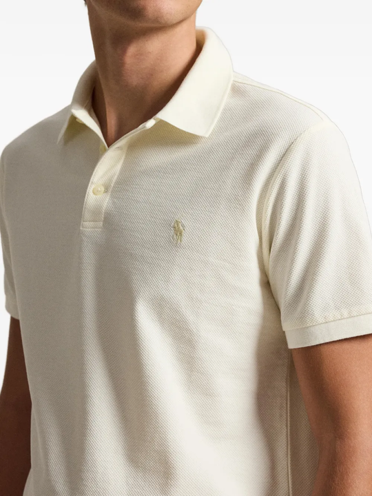 Tan shirt worn by a person, showing the shirt fit