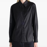 Black shirt worn by a person, showing the shirt's fit