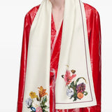 White scarf worn by a person, showing the scarf fit