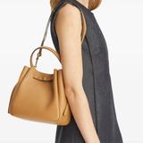 Brown bag worn by a person, showing the bag fit