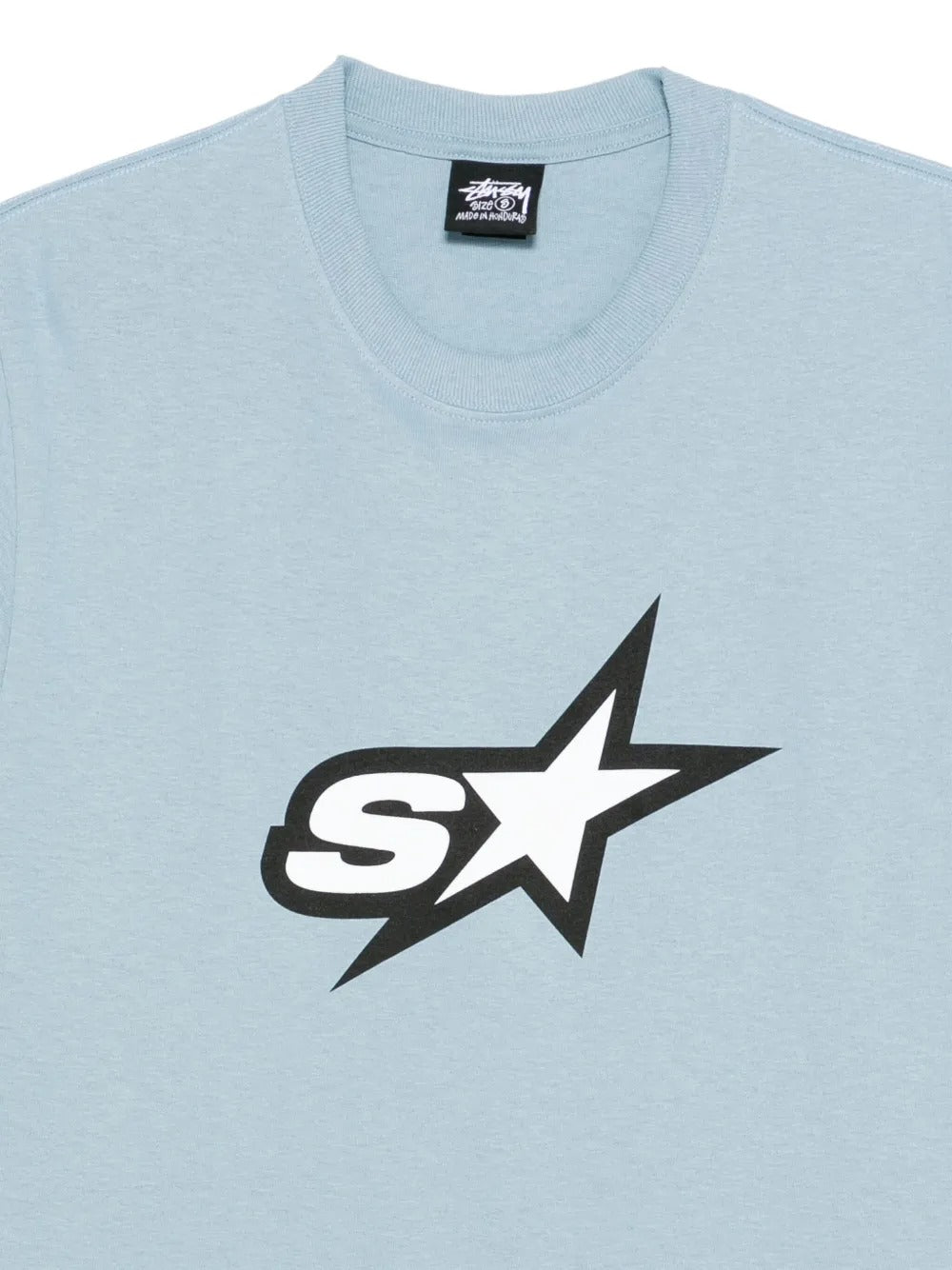 Close up of blue t-shirt, showing texture of the cotton fabric