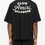 Black shirt worn by a person, showing the shirt's fit