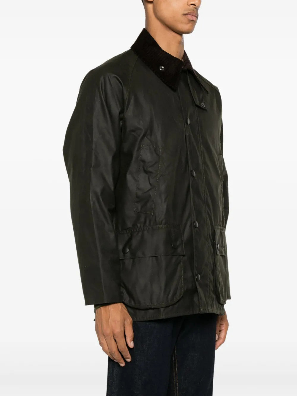 Green jacket worn by a person, showing the jacket fit