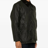 Green jacket worn by a person, showing the jacket fit